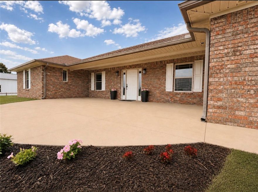 Rare opportunity in the heart of Farmington - w/ 2 dwellings, 2 acres, 1,010 SF shop, greenhouse & gardens. The 2,427 SF all-brick main home offers 4 bedrooms, 3 full baths, mudroom, home office, XL bonus room, and storm shelter. 2023 renovations include flooring, paint, lighting, appliances, fireplace, 2nd HVAC & extended entertaining patio. The 40x50 metal building includes a fully finished 990 SF studio apartment/guest house (2023) - w/ its own address, septic system, full kitchen, full bath, & laundry - ideal for multi-generational living, guest quarters, rental income etc. The remaining 1,010 SF is excellent shop/workshop/garage space w/ dual overhead doors & mezzanine storage. A separate 32x15 insulated, heated/cooled outbuilding w/ power offers even more flexibility & workspace. Outside, enjoy ample parking, raised garden beds, chicken coop & peaceful views backing to farmland for added privacy - all within walking distance of Main Street, schools/restaurants/amenities & just minutes to Fayetteville.