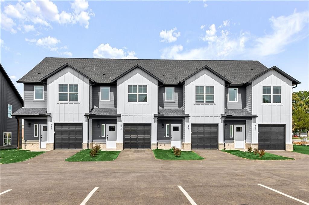 Welcome Home! You are going to love these newly built townhomes, featuring three bedrooms and 2.5 bathrooms, nestled in the vibrant Pea Ridge school district. These gorgeous homes boast a one-car garage, an additional parking spot in the driveway, and luxurious granite countertops paired with sleek stainless steel kitchen appliances. The convenience extends to the inclusion of a washer and dryer in each home. On the first floor, an inviting open floor plan awaits, complete with a central kitchen island and large pantry. Upstairs you will find a large master suite with double sinks in the master bath and 2 additional spacious bedrooms and an additional full bath. Embrace the community spirit with a location within walking or biking distance to all Pea Ridge Schools, and relish proximity to Pea Ridge City Park with its trails and splash park. Additionally, these townhomes are conveniently situated less than 9 miles from I-49 and the new Walmart Home Office.