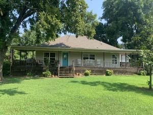 Perfectly private is what I call this adorable 3 bedroom 2 bathroom home! Offering 1475 sq ft, 2 car detached garage, and a covered wrap around porch it is MOVE IN READY! Call today and don't miss out!