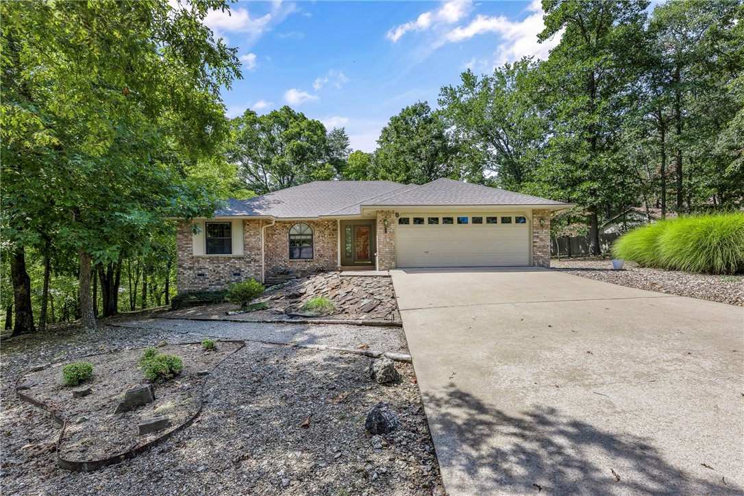Immaculate custom built home on a quiet cul-de-sac in the Heart of Bella Vista! Sitting on a level half acre landscaped lot with mature trees. Offering open living space including formal dining as well as a light filled eat-in- kitchen. Beautiful cabinets and smartly laid out kitchen that opens to sunroom/porch. Large main bedroom has double vanities and double closets. Living room focal is a Gas log fireplace. Lower Level 16x26 ft heated and cooled workshop/storage/golf cart storage, adds so much value. Comfort, function and style combined makes this home move in ready. Added benefits : Near Trails, Lake Windsor access, Tanyard Creek golf range , BV Country Club ,Town Center shops. Bentonville Schools. Covered deck overlooks large level back yard. Roof 2019 ,HVAC just serviced,new dishwasher and disposal. I know you will love this home.