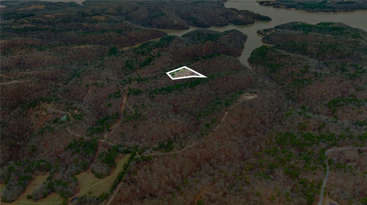 Discover the perfect canvas for your dream home with this stunning 5-acre tract in Emerald Bay subdivision. Boasting breathtaking views and endless potential, this property offers a serene retreat near the lake. While well water and septic are needed, electricity is already on-site, making your building process more convenient.
Located just minutes from the historic War Eagle Mill and a short drive to downtown Rogers, youāll enjoy the perfect balance of peaceful living and easy access to amenities. Whether youāre envisioning a custom home or a weekend getaway, this property provides the ideal setting to bring your vision to life. Donāt miss this rare opportunity to own a slice of Emerald Bay!