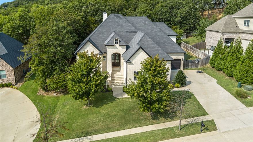 Welcome to 3094 E Crestline Place, a stunning residence nestled in a desirable Fayetteville community, Stone Mountain Subdivision. This home was built by a Fayetteville local builder in 2017. One family has lived in this home making it the first time it has been on the market as a resale. You don't want to miss the opportunity to buy this house. Walk through the double front doors into an amazing living room space with vaulted ceilings and exposed wood beams. The back sliding door off the living room opens onto a deck that is great for hosting family and friends. Sit outside and enjoy the wildlife as this home backs up to the woods. Hang around the outdoor fireplace and enjoy a Razorback game on the tv. The home is an open floor concept with a beautiful eat-in kitchen opening up behind the living room. Finish up the tour walking through the beautifully designed primary bedroom suite and 3 guest bedrooms and media room. 3 Bedroom located on main floor, 1 bedroom, bathroom, and media room upstairs.