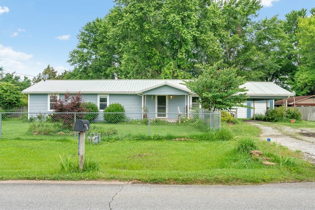 Don't miss the opportunity to enjoy this cozy Elkins cottage! Relax in the lovely back yard with over half an acre for gathering with family and friends. Located in the heart of Elkins, the large lot provides a country setting, yet with all the conveniences just minutes away. Large living room with beautiful stone fireplace and spacious kitchen make this home extremely livable with room for everyone. Come see it today!