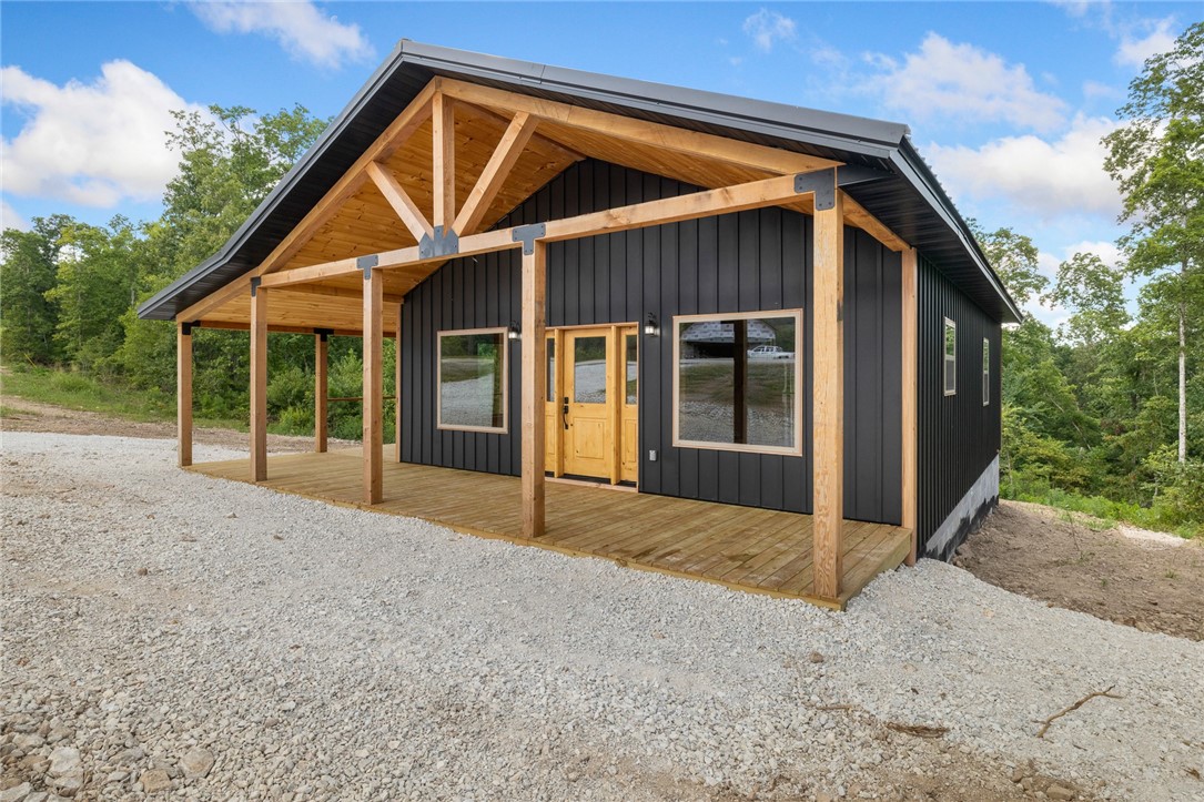 Discover your perfect escape in the heart of the Ozarks with this stunning brand new 2 bedroom, 2 bathroom cabin located just off Hwy 74 in Jasper Arkansas, offering easy access and unbeatable convenience. Featuring a striking black steel board and batten exterior paired with a durable metal roof, this home blends modern design with rustic charm with a low maintenance design.
Step inside to warm wood plank walls, an open living space, and quality craftsmanship throughout. The cabin is equipped with central HVAC for year-round comfort, making it ideal as a full-time residence, weekend getaway, or income-producing nightly rental.
Relax on the spacious wrap-around porch and soak in the peaceful surroundings, just minutes from the Buffalo National River, hiking trails, and the shops and dining of Jasper Square. Whether you're looking for adventure or serenity, this property delivers both.