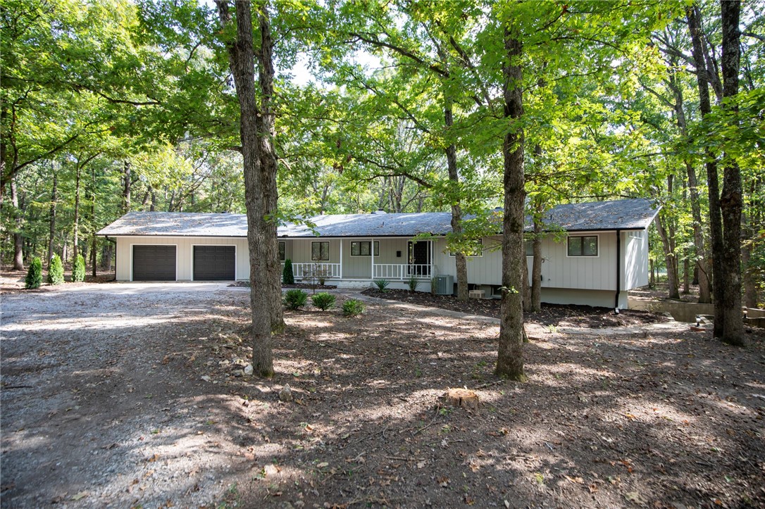 Beautifully updtated Single Family rural home sitting on just over 5 acres in Bentonville school district! This home features approx 3,129 square feet of living space that includes 5 bedrooms, 2.5 bathrooms, large living room and kitchen, luxurious wood floors, granite counter tops, 2" faux wood blinds, all new paint inside and out just to name a few. With its acreage and spacious layout, itās ideal for someone looking for a property with both home comfort and significant land. Enjoy piece and quiet while you take in natures beauty all within just minutes to schools, shopping, resturaunts, I49 and much much more.