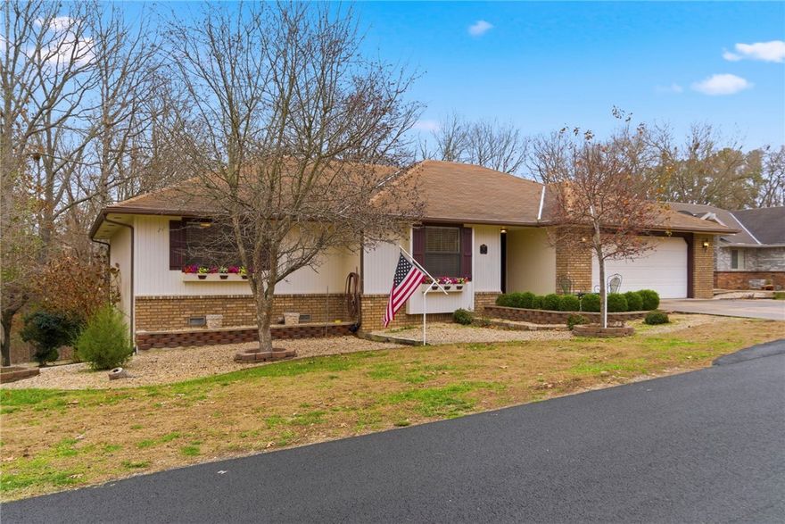 Prime Bella Vista location near Blowing Springs and miles of NWA's top biking and walking trails! This well maintained, one-owner home may feature some dated finishes, but it has been exceptionally cared for from day one. The sale includes the additional lot next door creating a rare, oversized property with extra privacy and room to expand. A private path leads around to the backyard, where a natural wooded barrier offers excellent screening from the road - ideal for RV or trailer parking. Inside, enjoy 3 bedrooms, and 2 baths. Property also features an additional garage/workshop plus a heated and cooled bonus room, perfect for hobbies, office or workout space. Located on a quiet cul-de-sac in the Bentonville school district with quick access to parks, shopping, and the Bella Vista greenway system.
Additional lot will not be sold separately.