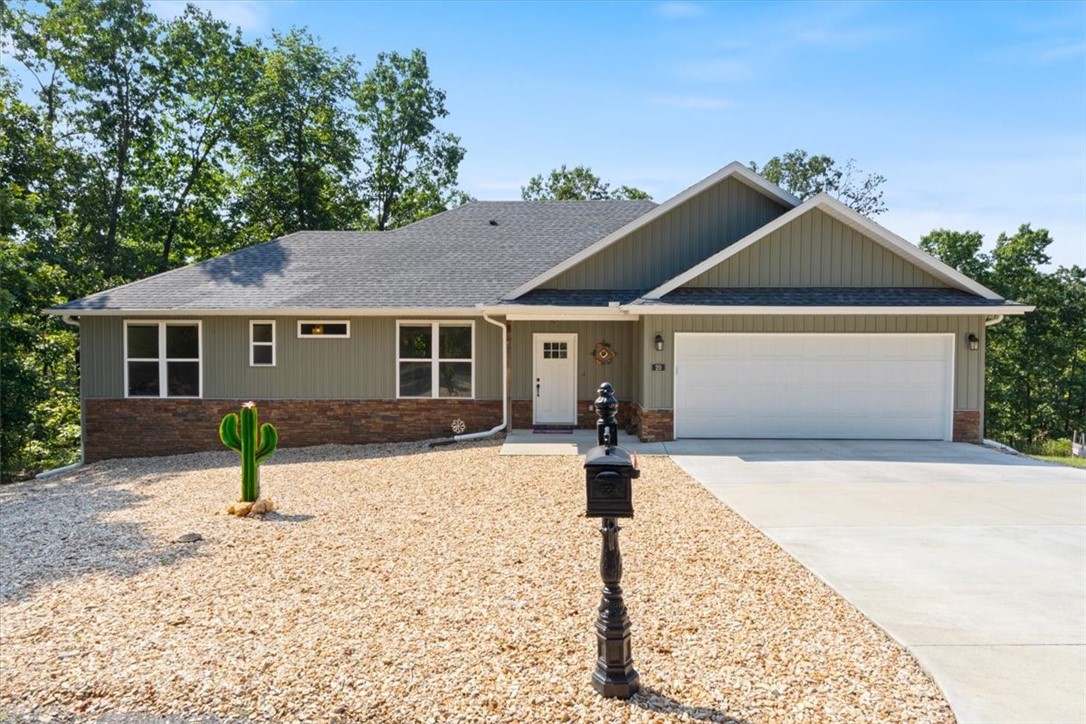 Built in 2023, this thoughtfully designed 2 bedroom + office home combines modern comfort with peaceful seclusion. An entire culdesac for privacy! Set on 4.04 acres, the property offers the perfect blend of open living and natural beauty. Inside, a wall of windows fills the living, dining and kitchen space with natural light while framing serene views of the surrounding trees. The feeling of living in a treehouse! The open concept layout features a cozy gas log fireplace and a designer kitchen with a gas cooktop, large island and an abundance of cabinet storage, ideal for both everyday living and entertaining. An oversized two car garage w/space for a workshop and a full-size truck! The 580 SF covered, no maintenance composite deck spans the back of the home -- perfect for outdoor dining, relaxation and soaking in the peaceful privacy of your acreage. 50/30 Amp RV hookup. 4 acres includes a separate buildable 1 acre lot that has been perc tested. Walk out crawl space for storage! Even a covered, fenced pet yard!
