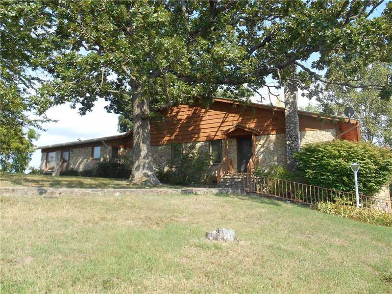 138 acres, main house, guest house, updated barn with room for a RV, storage building, rabbit house, and smoke house. Views from this mountain top house are breath taking. Rock siding, metal roof, wet bar, wood stoves, this home has room for everyone.,Barn is in perfect condition. Guest house can be used as a rental to produce income. Emergency generator is wired in and conveys. Acreage has hardwood, pond, spring, cave, and great hunting. Agent must be present on all showings.