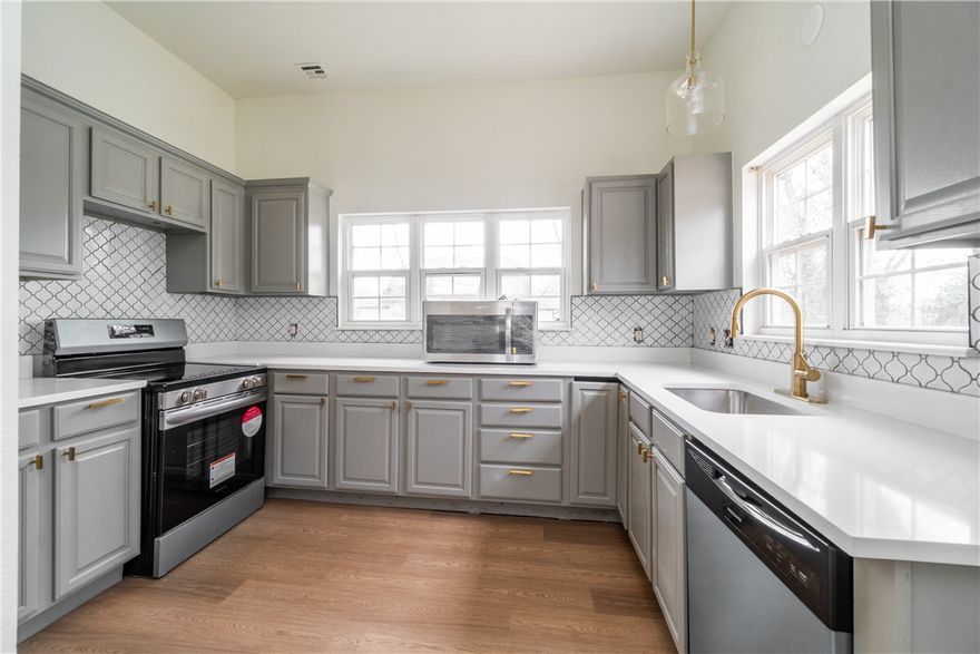 Located in the Heart of Gravette, this recently remodeled home boasts modern updates while giving you convenience to the parks, stores and restaurants! Updates include new LVP floors in the living room, kitchen and eat in dining area. Fresh paint throughout the home, new fixtures and granite counters give this home the feel of new construction.  New carpet was installed in the bedrooms and up the stairs and all bathrooms have new tile floors. With a new roof, new decks and HVAC condenser installed in 2024, this Turn-Key home gives peace of mind for low-maintenance living for years to come. The second bedroom upstairs would make an excellent office space, media room or gaming room. Don't miss out on seeing this opportunity before it's gone!