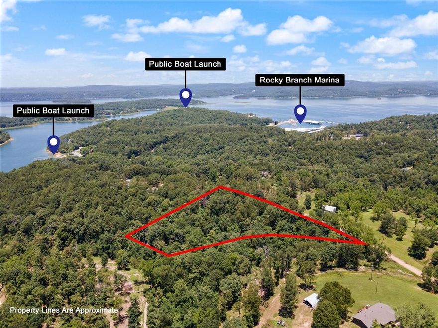 Rare find in Rocky Branch ! Looking for a level buildable place for a tiny home or cabin with municipal water available ? Only a mile and a half to the Rocky Branch Marina and public area with paved boat launch and swimming area. Lots on the west side are level and would be the best spot to build. Municipal water provided by Benton County Water Authority #5, right across the street. Nearby War Eagle Caverns, Hobbs State Park trails with War Eagle Mill, just a few minutes away. Per attached covenants, mobile home allowed on Lots 89-92, the flat area, see plat in attachments. Well on site but unknown to its condition. Per covenants, 680 sq. ft minimum footprint. GPS-Property is directly across from 20324 & 20292 Mockingbird Lane.
