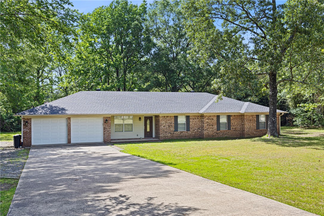 NEW ROOF! Assumable FHA Loan, currently 2.875% over 30 years. This beautifully updated 4-bedroom, 2.5-bathroom home offers approximately 2216 square feet of stylish living space, nestled on 1.74 peaceful acres atop scenic Linker Mountain. The spacious primary suite features a walk-in closet and large walk-in tile shower providing a comfortable retreat.The recently added back deck is perfect for enjoying the serene surroundings, while the location on a dead-end road ensures privacy. The oversized two car garage plus additional parking area allow for plenty of storage. Combining modern updates with a tranquil setting, this home is a must-see!