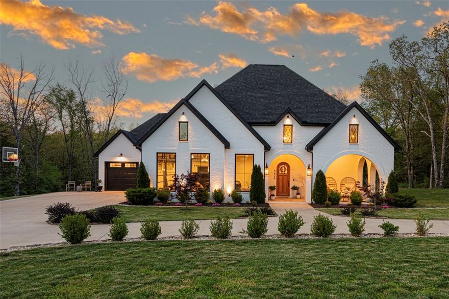 WELCOME HOME! This immaculate 4 bedrm 5.5 bathrm home on 2 acres in East Fayetteville is a dream w/ curved driveway & landscaping! Spacious front porch perfect for relaxing! Inside- a trendy interior feat: archways, 10’ ceilings & eg hard wood floors! Heading into the living rm find a media rm, office/playrm, & book nook! Main hub of home is open w/  16’ vaulted ceilings w/ beam details, arched windows, built-ins, & large gas log FP! Kitchen feats: lots of storage, pot filler, 6 burner gas range, quartz counters, & oversized island w/ quartzite! Plus walk-in pantry! Rejuvenate in primary suite w/ patio access, & large spa-like bathrm oversized soaking tub, walk-in shower, & walk-in closet! 3 more bedrms each w/ private bathrm! Laundry is spacious & includes built-ins & sink! Upstairs a bonus rm, full bathrm w/ clawfoot tub, & storage rm! Out back enjoy covered back patio, fireplace, & grill area overlooking the back lawn! Inside & Outside have built-in speakers! Wet weather creek at the back of property! Act now!