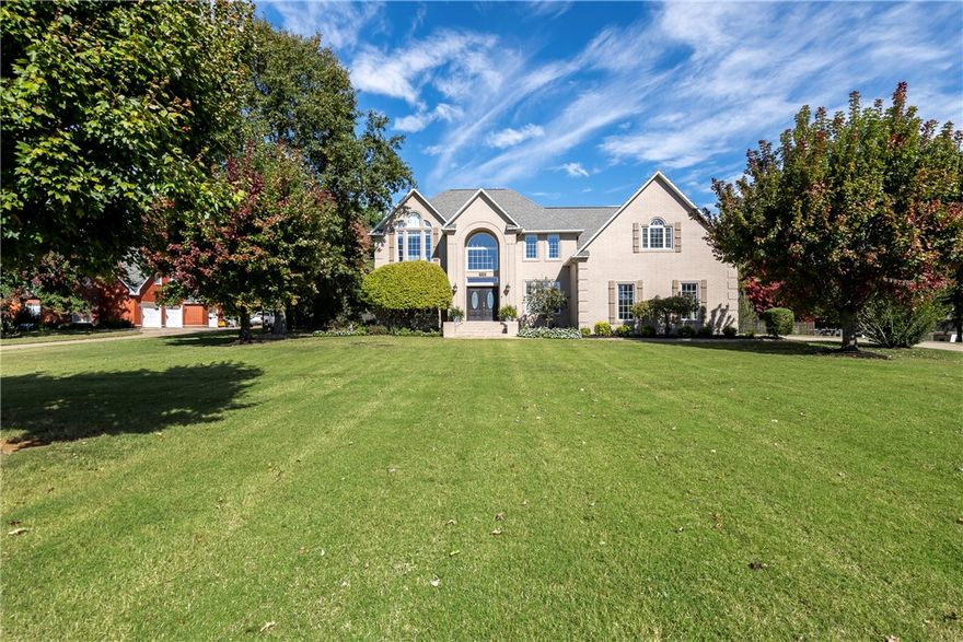 This is the opportunity you've been waiting for: a four bedroom, five bathroom home with saltwater pool on two private acres in the established Ridgemonte Estates subdivision of East Fayetteville. This traditional layout with transitional updates combines the best of both design styles. The upstairs split-floor plan separates the primary suite and secondary bedrooms and baths with the laundry room in between and bonus room at the far end. Downstairs, real oak hardwood floors run throughout the kitchen, formal dining room, family room, den, and office. Two half baths are located conveniently near each living room. A classically updated kitchen with white quartz countertops and subway tile backsplash to the ceiling looks out over the covered back patio with outdoor TV, pergola with wood burning fireplace, and large uncovered pool surround with professional landscaping. A wrought iron gate fences in nearly an acre of the back yard. Enjoy morning and evening eastern and western sky views from your own private oasis.