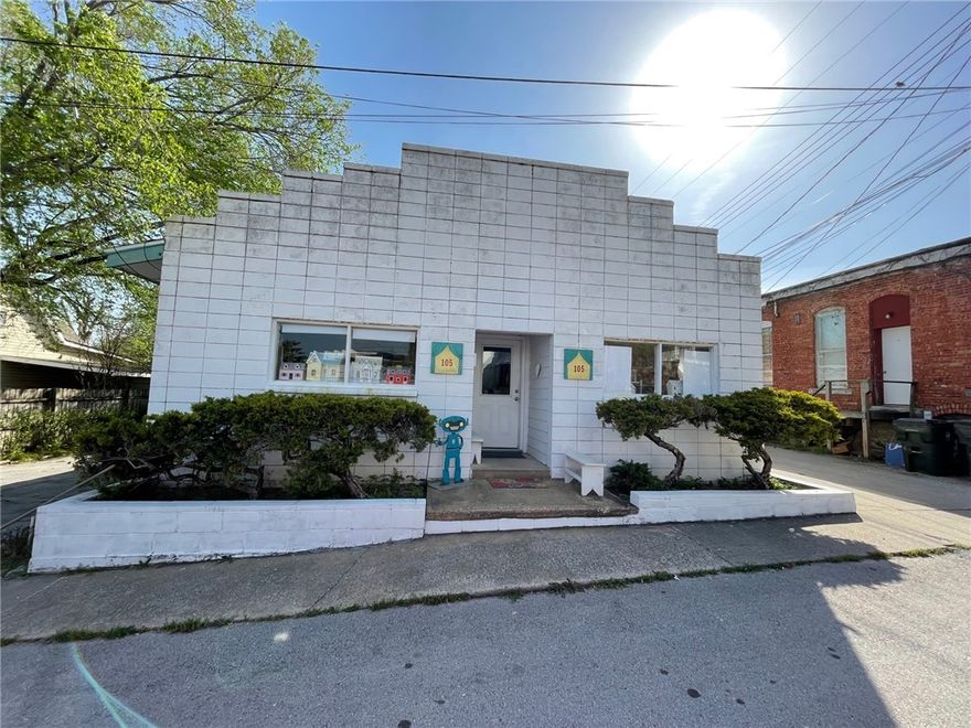 Endless Opportunities! This unique property offers incredible flexibility and potential. Previously used as a gift shop with living quarters in the back, the building features at least two bedrooms and one and a half bathrooms. Inside, you'll find several charming built-ins, including one that could serve as a children’s playhouse with additional shelving. The space could easily be transformed into a retail shop, professional office, creative studio, or boutique business. With a few adjustments, the living quarters could also be expanded to create a comfortable full-time residence or an income-producing Airbnb. Outside, you'll enjoy a cute privacy-fenced backyard along with two additional small structures on the property that could be used for storage, workshops, or creative spaces. Whether you’re looking for a business opportunity, investment property, or a unique residential conversion, this property offers endless possibilities limited only by your imagination.