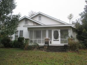 This beautiful country charmer is just minutes from town, but offers a beautiful view and that out in the country old fashioned feel. Lots of room, lots of beautiful features inside. Updated kitchen, lots of windows provide great natural lighting, and this has that ''I'm at home'' feel.