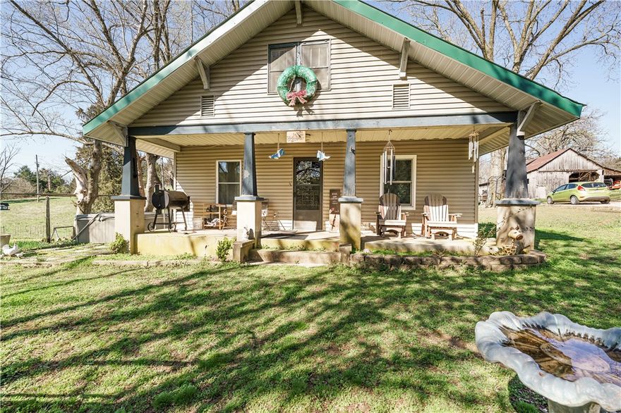 Spacious 5-bed, 2-bath home on 15.79 acres (m/l) of mostly open pasture—perfect for livestock, farming, or peaceful country living. The home features 3 beds on the main level and 2 upstairs, along with a half bsmt for additional storage or flexible space. Beautiful wood flooring throughout much of the home, adding warmth and character. Enjoy the convenience of a Jack-and-Jill bath, plus a bright and inviting sunroom—ideal for relaxing w/views of the property. The property is well-equipped with multiple outbuildings, three older 32x380 chicken houses that offer excellent storage or potential for agricultural use. Property includes a 2-car garage, 2-car carport, general-purpose barn, and other outbuildings. The land is supported by two wells and two septic systems, adding flexibility and functionality. As a bonus, there is a separate 3-bedroom, 2-bath mobile home currently occupied, providing immediate rental income potential. This property offers space, functionality, and income —all in a peaceful rural setting.