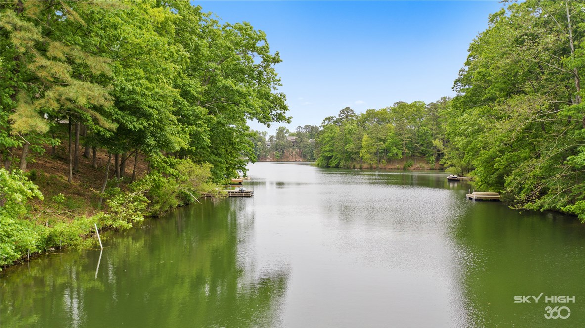 Welcome To Your Next Home! Beautiful Lake Front Property On Lake Rayburn. Offers Seemingly Endless Living And Entertaining Options Inside And Out Allowing For Several Areas To Relax And Take In The Beautiful Views. Outside You'll Enjoy A Recently Updated Wrap Around Deck That Continues On Either Side Of The Sunroom. Inside Offers 3 Separate Living Areas - The Main Living With New Wood Flooring, A Secondary Living Area That Could Also Be Converted To A 3rd Bedroom, And A Fantastic Sunroom Off The Main Living. The Kitchen Offers Plentiful Space Along With Eat-in Dining & Bar Seating. Formal Dining Just Off Kitchen. Large Laundry/Utility w/ Space For Secondary Fridge. The Home Also Offers A New Roof In 2019, New Exterior Paint And Is Approved For A Boat Dock. Huge 0.64 Acre Lot. This One Is A Must See!