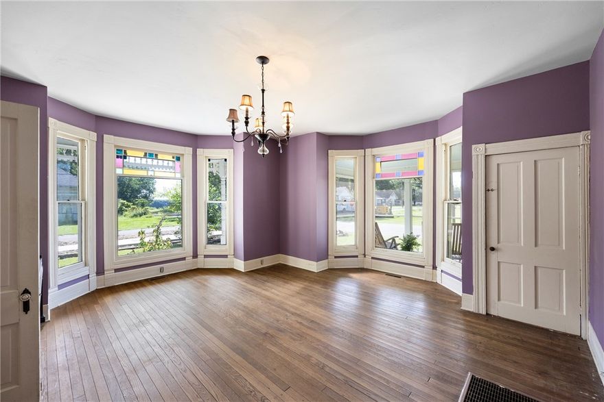 This Victorian Gothic treasure is proudly listed on the National Register of Historic Places. The intricate Carpenter Gothic trim, weatherboard siding, and cross-gabled roof create a striking first impression. The large covered front porch welcomes you to slow down and take in the charm of historic Dardanelle.
Inside, the original hardwood floors have been preserved and the kitchen shines with custom cabinetry, stainless steel appliances, and butcher block countertops. The bathroom has been thoughtfully updated to include heated tile floors, a large walk-in shower, and the original clawfoot tub.
Upstairs, charming doors open onto small balconies where you can take in stunning views of the Arkansas River.
Just beyond the front steps, Dardanelle has a brand-new sidewalk and trail system that stretches down Front Street and winds its way to Merritt Park. This beautifully designed path offers a scenic connection through the heart of town and along the riverfront adding even more to the home's unbeatable location.