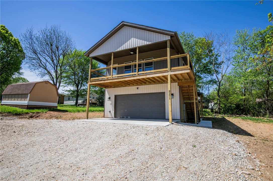 Great view!!! Beaver lake is just a few steps away from this 2 bed 1 bath home in Beaver Shores. New Construction vaulted ceiling with open floor plan through living room and kitchen. Granite counters, refrigerator, over the range microwave, dishwasher and full size washer and dryer included. Wood style flooring throughout. Lots of natural lighting. Nice deck to enjoy and lots of storage. Garage does not convey. No Pets.