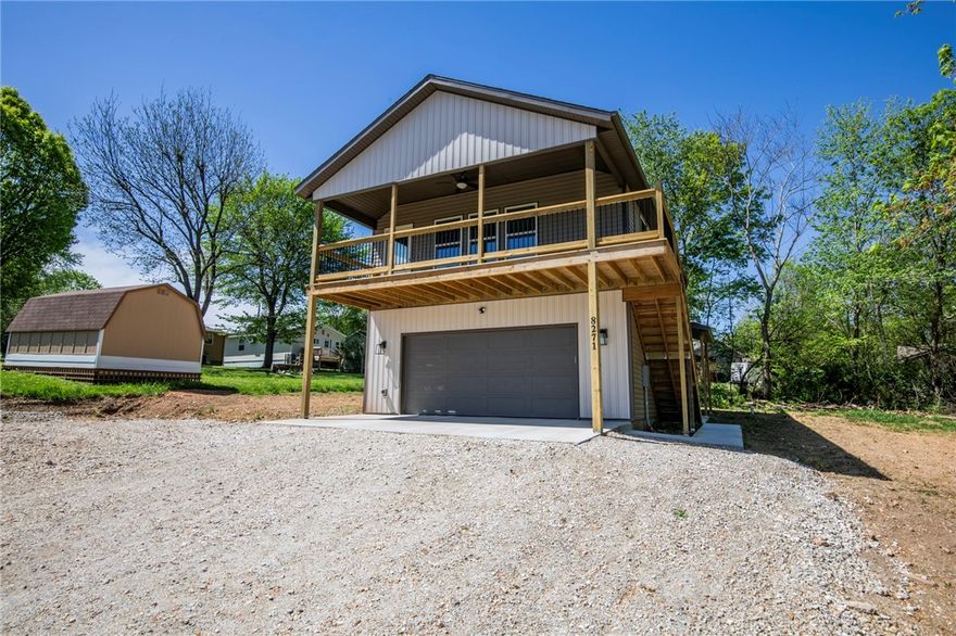 Great view!!! Beaver lake is just a few steps away from this 2 bed 1 bath home in Beaver Shores. New Construction vaulted ceiling with open floor plan through living room and kitchen. Granite counters, refrigerator, over the range microwave, dishwasher and full size washer and dryer included. Wood style flooring throughout. Lots of natural lighting. Nice deck to enjoy and lots of storage. Garage does not convey. No Pets.