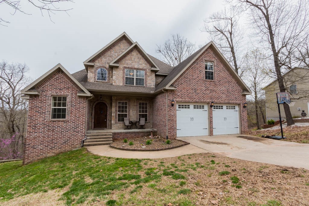 This lovely home is conveniently located less than a mile from Beaver Lake & close proximity to Prairie Creek Marina & Park. Home features 2 fireplaces, beautiful tree top views from one of the two decks. Perfect home for entertaining guests inside & out.