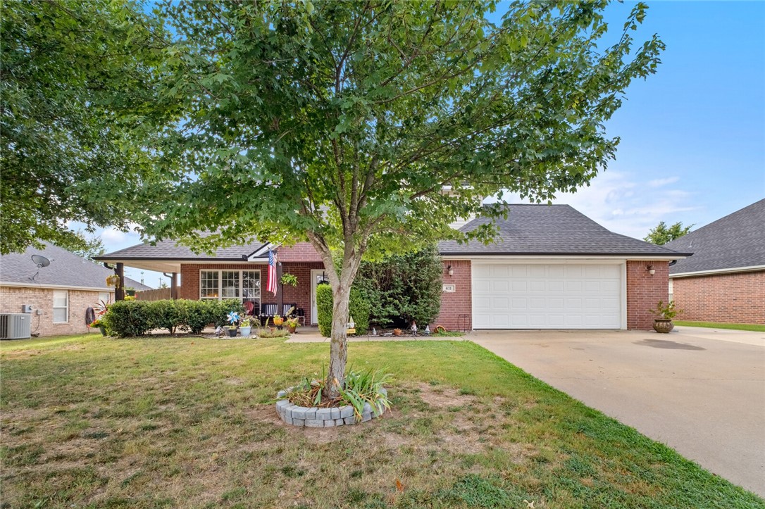 Charming 3-bedroom, 2.5-bath home with plenty of space to enjoy. The main living room boasts soaring vaulted ceilings—tall enough for that perfect holiday tree—while a second living area adds versatility for entertaining or relaxing. All bedrooms are located upstairs, offering privacy and comfort. Outside, you’ll love the welcoming covered front porch and the backyard retreat featuring a spacious patio, built-in outdoor fireplace, and even a hammock post for lounging. This home offers the perfect balance of cozy indoor living and inviting outdoor spaces.