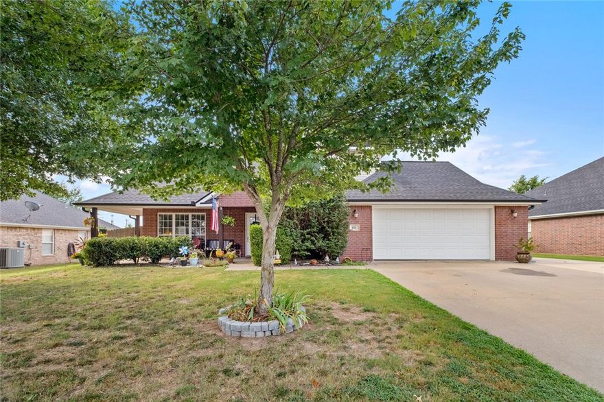 Charming 3-bedroom, 2.5-bath home with plenty of space to enjoy. The main living room boasts soaring vaulted ceilings—tall enough for that perfect holiday tree—while a second living area adds versatility for entertaining or relaxing. All bedrooms are located upstairs, offering privacy and comfort. Outside, you’ll love the welcoming covered front porch and the backyard retreat featuring a spacious patio, built-in outdoor fireplace, and even a hammock post for lounging. This home offers the perfect balance of cozy indoor living and inviting outdoor spaces.