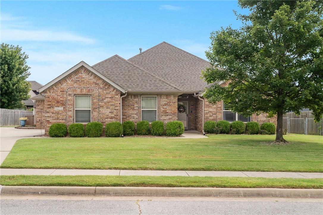 This home truly checks all the boxes! Featuring 3 bedrooms, 2.5 bathrooms, and a split floor plan, it has hardwood floors throughout, oversized bedrooms, and walk-in closets—some with built-in drawers for extra storage. Enjoy the convenience of being just minutes from Pinnacle, Top Golf, Target, the Promenade, and more, while coming home to your own private retreat. Picture yourself sipping coffee on the beautiful screened-in porch, or hosting friends during football season in the cooler months. Sitting on just over a quarter acre, the property includes a large outdoor storage shed and an impressive 3-car, temperature-controlled garage with a 240 Volt EV charger. The huge flat driveway provides ample space for parking and play. All of this is located within the highly sought-after Bentonville School District—a perfect blend of comfort, convenience, and location!