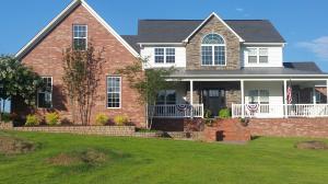 Stunning Stonegate home on the water! The layout of this 4 bedroom, 2.5 bath is absolute perfection! With a dedicated office, gorgeous open concept kitchen/living area, an additional living area at the top of the stairs, a huge game room/entertainment space and a 3 car garage with a 4th bay for lawn equipment, this home has it ALL! The custom kitchen, upgraded flooring, beautiful ceilings, eye catching staircase, lovely doorway transoms, and other custom features, are just icing on the cake! Enjoy summers fishing in the back yard or camp fires in the common area that connects to the back yard. Stay comfortable with a cozy fireplace, on-demand water heaters and 2 HVAC units. High Style and Low bills! This is the home you've been searching for...