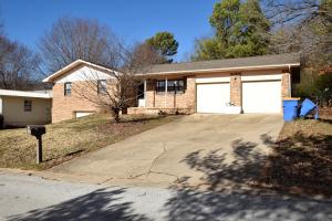Nice three bedroom, brick and frame home in a popular neighborhood in Harrison. The master bedroom has direct access to the large bathroom with double sinks. Ample storage throughout. Custom kitchen cabinets, some with glass fronts. Double garage on main level. One car garage and large storage area in unfinished basement. Storage room behind garage. Garden spot with water tank and large fenced yard.