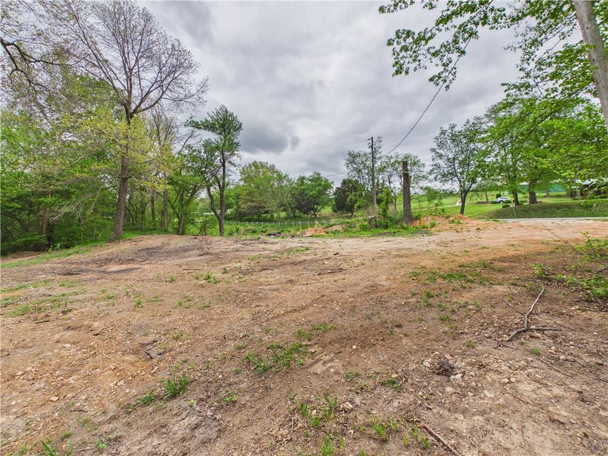 Check out the potential for this +/- 2 acres of land that could be used for commercial use, Airbnb, or a place to call home. This natural beauty is nestled between Hwy 62 & Long Creek. The land has been mostly cleared, saving you time and expense while giving you a head start on development. Utilities are already located on the property. This will allow you to see where you would like to have your house or business situated. Highway 62 frontage on one side and Long Creek on the opposite side. Just on the edge of town, with the nearest store approximately 0.2 miles away. It is going to be hard to find a location that has highway frontage for easy access, along with high visibility & have such a peaceful setting at the other edge of the property.