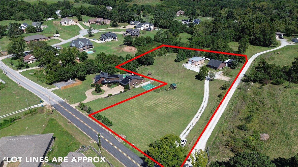 3.50 +/- acres in Bentonville! Just minutes from the Coler Mountain Biking Preserve. Property comes with a pole Shed (1030 sq) and 2 utility buildings (1200 sq & 2664 sq). Adjoining 1 acre with house, pool, basketball court and guest house can also be purchased. See MLS# 1316848