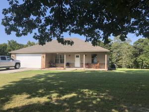 1989 Millcreek Road - Excellent condition 3 year old brick house with wide front porch, double garage, large deck, wood flooring,tray ceiling, kitchen island, walk-in closet, walk-in tile shower, split floor plan on a manicured one acre lot. $152,900 MLS# 20-