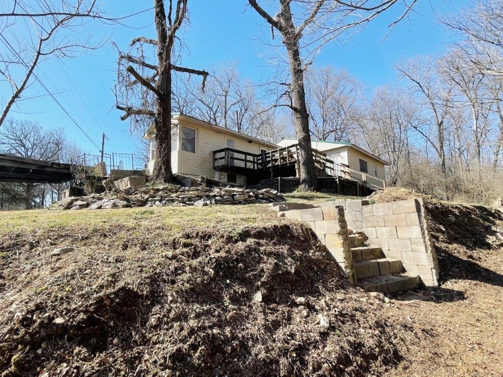 Monte Ne area cottage ready to remodel. Walk to the lake from this investment potential. Seasonal views. Sold AS-IS, no repairs. Seller is accepting Cash or Hard Money Loans only. This property is part of a First Look program. Owner Occupant offers can be negotiated on day 6 of being listed. Investor offers are negotiated on day 31 of listing.