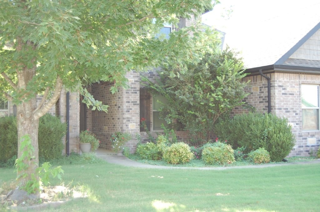 5 bedrooms, 2.5 baths, oversized side entry 3 car garage, in floor tornado shelter, workshop and storage in garage. Tall ceilings, custom trim and cabinetry, hardwood, tile and carpet floors. Split floor plan, dining room, SS appliances. Outdoor fireplace and huge covered patio. Great neighborhood.
