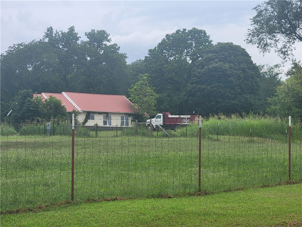 Incredible opportunity awaits for the right buyer or investor! Prime opportunity in Gravette, situated in a peaceful setting, this home awaits your vision and creativity. Brimming with possiblities, this would make the perfect oasis for your mini-farm.