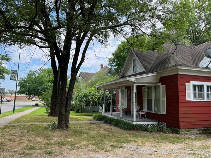 This fixer upper is a diamond in the ruff! Walking distance to downtown Siloam Springs. This sweet bungalow is the perfect opportunity to create the best air b-n-b, short term vacation rental property. 3 bedroom 1 bath with a nice sized bonus room upstairs. Original features of glass doors from living room to front bedroom/office or den with roll out casement windows. Home has central heat and window air conditioners. This home is to be sold "as is" and will be a blank slate for many options with investment opportunities. Also, could serve as a great first home and allow for sweat equity to build as projects are completed at a pace of preference & budget. Come explore the many options & opportunities this property offers as a dandy downtown dream in this sweet community!
