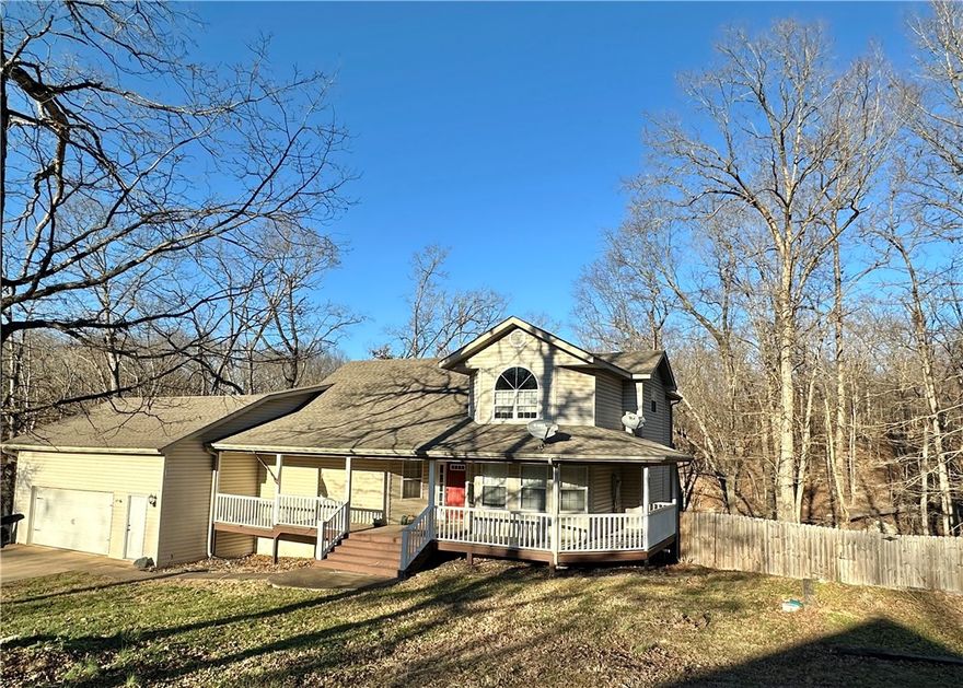 This exceptional home truly offers the best of both space and privacy, situated on 1.11 acres at the end of a quiet cul-de-sac. With 3,903 square feet, the thoughtfully designed layout provides flexibility for a variety of living needs. Enjoy the sunsets on the beautiful wrap around porch.

The lower level features a spacious “man cave” that opens directly to the in-ground pool in the fully fenced backyard, perfect for entertaining. This level also includes a kitchenette and full bath, making it ideal for an in-law suite or guest quarters, along with additional flex space that could serve as a storm shelter, thanks to its block construction.

The main level offers a welcoming flow with a spacious kitchen, living room, dining area, and two bedrooms, including the primary suite. Upstairs, you’ll find two additional bedrooms, a full bath, and a cozy loft area, perfect for a home office, reading nook, or play space.

This property combines privacy, versatility, and room to grow—both indoors and out.