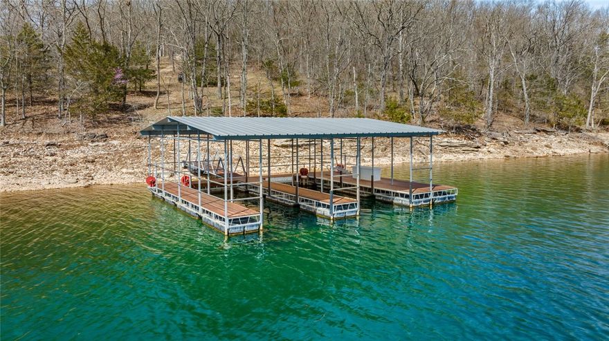 LAKEFRONT 2.61 ACRES WITH PRIVATE 2 SLIP (10X28 slips) BOAT DOCK!!  The lots feature a moderate slope that allows for a walkout basement home and walk down access to the shoreline of beautiful Beaver Lake. The FOUNDATION has been poured for a 3,000+ sq. ft. 3 level home, and awaits your finishing touches. Nestled in a pristine setting, nature abounds, catching site of playful deer, red fox, wild turkey, and American Bald Eagles at one of the prettiest coves on the lake...Indian Creek! Build your dream home on the exceptional, one-of-a kind lot with panoramic views of Beaver Lake. This lot offers an unparalleled location and is the perfect canvas for your custom designed home.  Experience the pinnacle of lake living where the serene waters of the lake meet the horizon, so you can immerse yourself in the tranquility of nature with beautiful sunrises painting the sky. Dreams "DO" come true!
Don't miss the chance to own a slice of paradise. Schedule your showing, and make this fabulous property your reality!