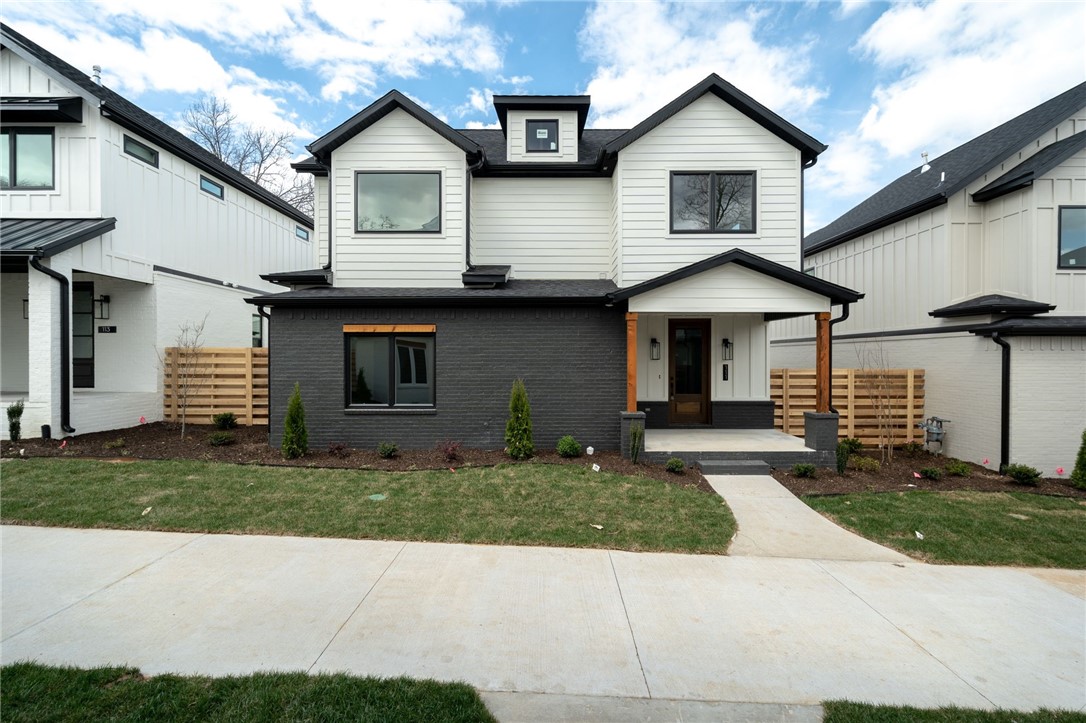 Introducing 111 NW Ozark Way of Oz Village. A downtown Bentonville neighborhood that boasts modern craftsman style with beautiful, high-end finishes. This is luxury, low-maintenance living just minutes by bike or foot to Oz Trails, Compton Gardens, the square, Crystal Bridges Museum, restaurants, shopping and the heart of Bentonville. This single family has a private side yard with patio. 4 Bedrooms (or 3 plus office), 3 full baths, 2 car attached garage. The community has "front porch living" in addition to community green space and guest parking for the Village.