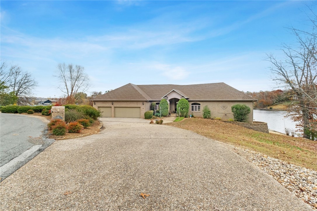 1st time offered. Perfect lake retreat. Additional 624 sq ft of unfinished room in Basement, and Cart Garage/shop has HVAC on lower level. Beautiful cabinetry throughout, Large Cedar Closet, and massive his & her closets in Master Bedroom. 4th of July fireworks from Loch Lomond dam view from Deck. Must see to appreciate.
Living Room has power sun screens. 500 Gallon buried Propane Tank, new roof October 2021