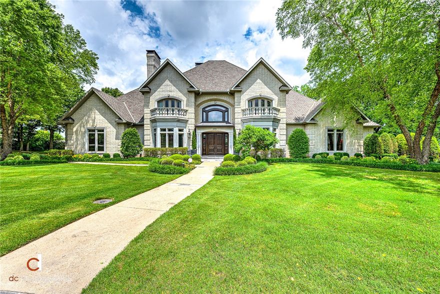 EXQUISITE CUSTOM BUILT EUROPEAN-STYLE ESTATE TUCKED AWAY ON A 1.11 ACRE CUL-DE-SAC LOT IN AN ESTABLISHED NEIGHBORHOOD CENTRALLY LOCATED IN NORTHWEST ARKANAS!  This Preston Bacon built masterpiece offers gorgeous outdoor living spaces with multiple covered patios and spacious veranda/balcony overlooking a private view with in ground heated pool.  The 6,800 sq ft interior has been meticulously crafted with attention to detail throughout and features beautiful walnut flooring,  antique light fixtures, 2-story foyer w/ curved staircase, large formal dining with dual sided fireplace shared with newly remodeled must-see kitchen, spacious living room w/ fireplace and custom built-ins & wet bar, main level master retreat w/ luxurious en suite bath featuring marble counter tops and travertine flooring, private study w/ coffered ceilings, and main level guest suite.  Second level hosts 3 gracious bedrooms each w/ an en suite bath, large living/media room w/ wet bar, study/office area great for kids!