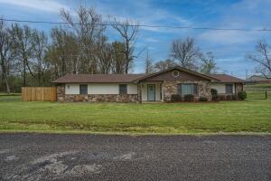 MOTIVATED SELLER!! HUGE PRICE REDUCTION!! Diamond in the rough. 3 bedroom 2 bath bungalow in city of Dardanelle. Hardwood floors in bedrooms, dining room and living room. Needs trim work etc. Oversized yard with outbuildings and gazebo. New roof in December. Being sold AS/IS.