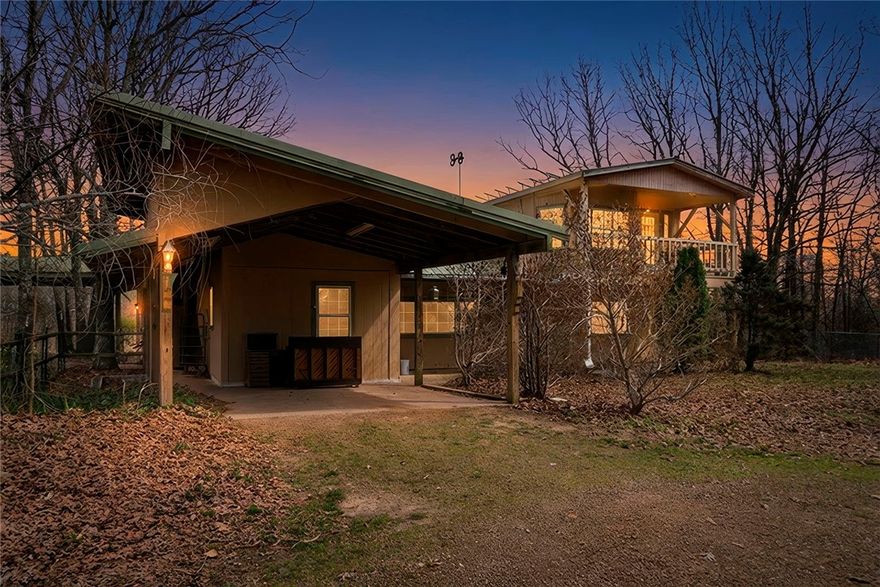 Tucked on 17 acres of pasture and woods, this 3-bed, 3-bath property is a rare find for those craving space, self-sufficiency, and room to grow. The main home features a sunroom perfect for seedlings, a huge pantry, vinyl plank and tile flooring, wood cabinets, and central HVAC plus wood-burning stoves for backup heat. The second story — added by a contractor — includes a third bedroom with its own wood stove, walk-in closet, and double-pane windows. Double porches, metal roof, a fruit orchard, and a stocked pond with catfish and koi complete the outdoor picture. The 320 sq ft studio apartment is perfect for guests, rental income, or a home office. The workshop/garage has power, built-in benches, and ample storage. A chicken coop, fenced pastures for horses or cows, and the greenhouse — previously used for commercial growing — make this a hobby farmer's or small business owner's dream. All appliances except the refrigerator convey, plus the chest freezer. 8 min to Winslow, 15 min to West Fork, 35 to U of A.