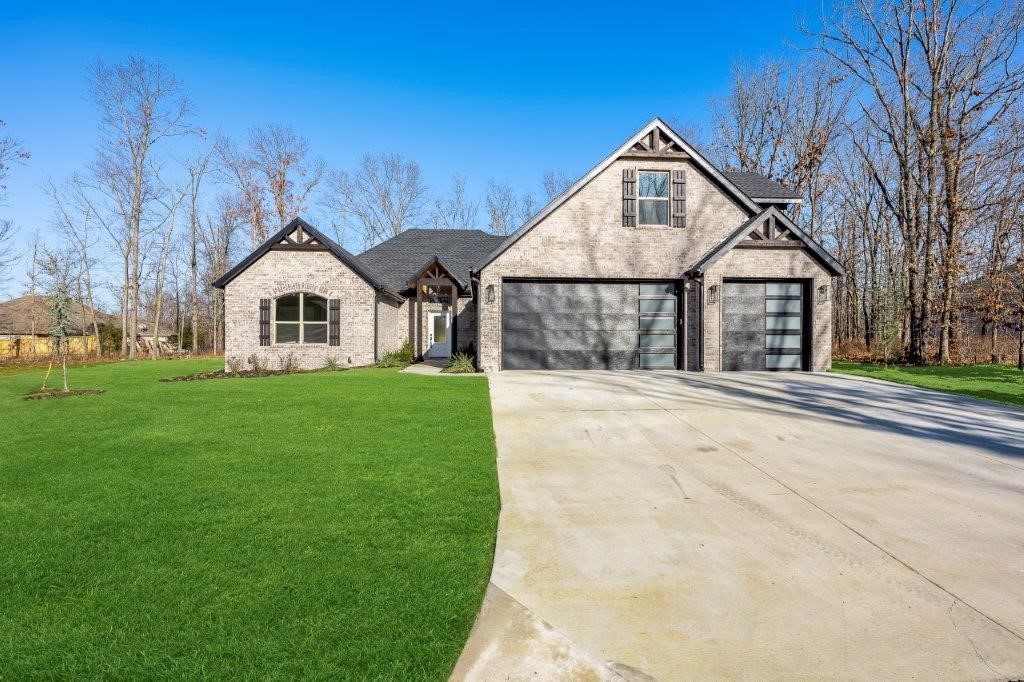 Amazing find! This elegant estate home sits on 2 flat lots (.58 acres) near Loch Lomond.
You will be impressed by all the high-end finishes in this split bedroom open concept floorplan.
Main level includes: Spacious living area with a linear fireplace, gorgeous beams, & hardwood floors. Gourmet kitchen features granite countertops, loads of soft-close cabinets & composite sink. 2 guest rooms + office. Primary suite with access to private patio, spa-like bath hosts expansive custom tile shower (2 shower heads/2 rain heads). Primary closet connects to utility area. Upstairs you will find a secret bonus room behind bookshelf like door, 3/4 bath, & Media room with wet bar & wired for sound. Enjoy nature on your massive covered patio with outdoor linear brick fireplace, & outdoor kitchen with sink - all overlooking your backyard oasis & nature. Prewired for Generac generator.