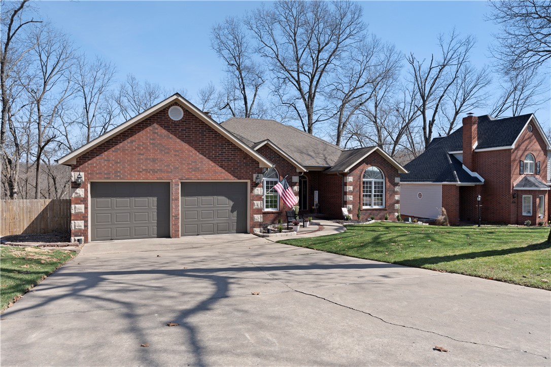 Welcome to one of the best listings in NWA in the highly sought-after Hidden Springs subdivision, just 2.5 miles from downtown Bentonville! This charming 3-bedroom, 2.5-bath with office is nestled amidst the serene beauty of north Bentonville providing a secluded outdoors feeling while still being just minutes away from the vibrant energy of downtown Bentonville. Take advantage of the nearby trail system, accessible via a convenient shortcut through the woods, and explore the scenic wonders of the area right from your doorstep. Inside, you'll find a welcoming ambiance that invites you to unwind and relax. Additionally in the crawl space below you will find plenty of room for a hobby shop or bike storage. Scan the QR code for a matterport virtual tour and video and book your showing today.