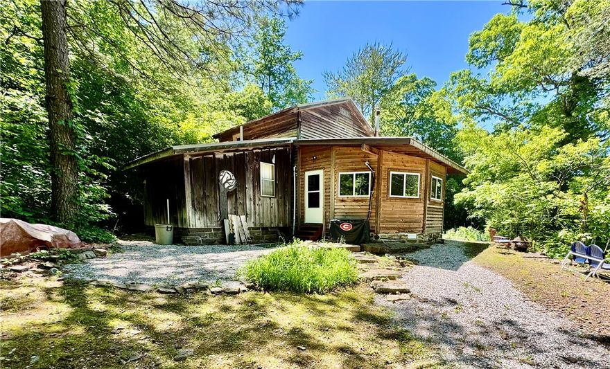 The ranch includes a spacious cabin designed to accommodate both weekend retreats and extended stays. The cabin features two bedrooms, one full bathroom, one half bath, a woodburning stove, and two separate living room areas that provide flexible gathering and recreational space. Rural water, electric service, and internet connectivity are already established on the property, supporting comfortable day-to-day use while maintaining a rural setting.