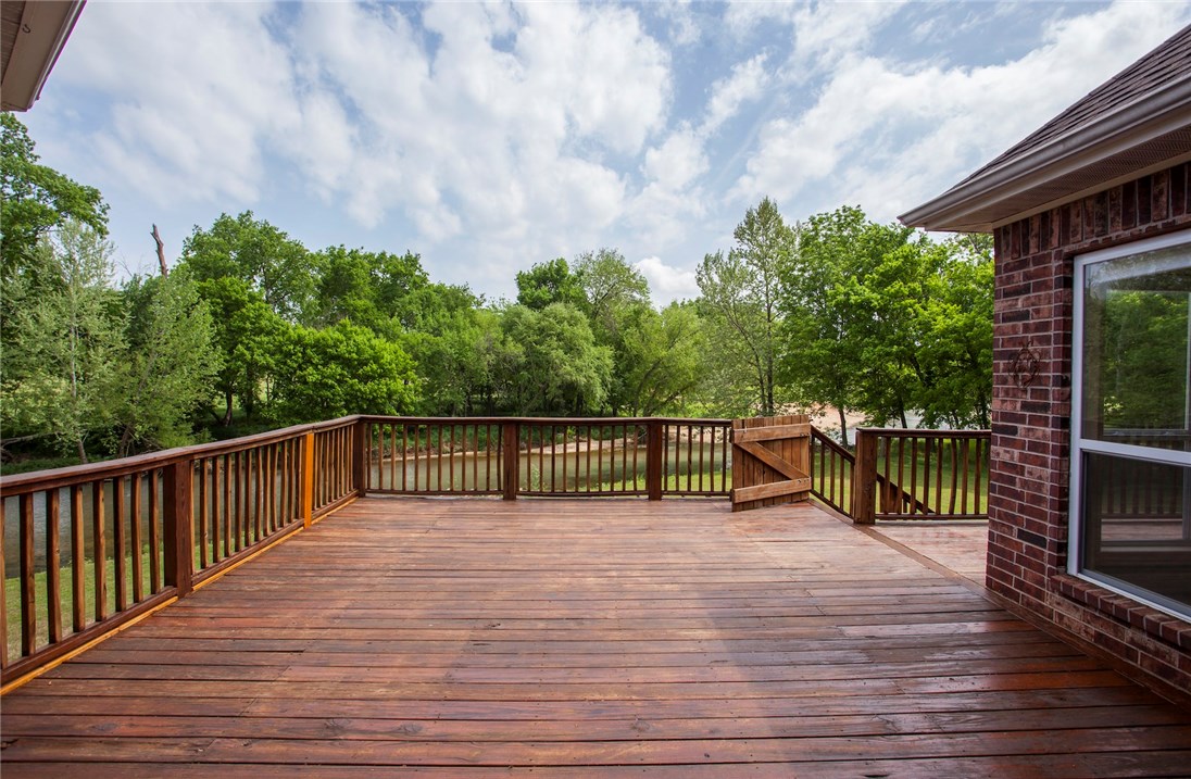 Welcome to the most versatile home on the market! This home is even zoned in the Bentonville schools/Cave Springs area! You'll love your home sitting on 2.40 acres with stunning Osage Creek behind home full of fish and sits just steps from the 13th hole on The Creeks Golf Course. The layout and floor plan is a masterpiece and enough to fit a large family. The location can't be beat, you're 5-10 minutes to any of the big four so (Rogers, Bentonville, Springdale, Fayetteville)