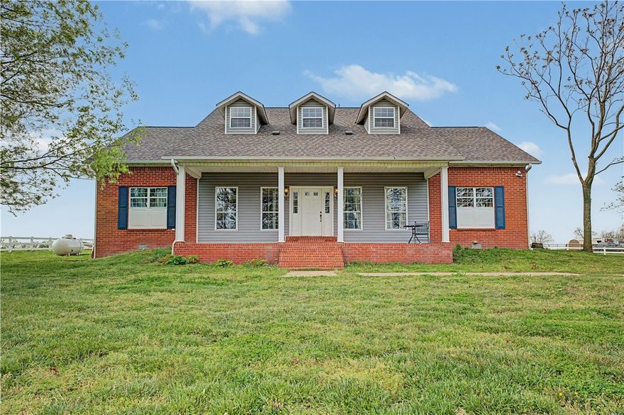 Situated at 20703 Safari RD in Gentry, Arkansas, USA, this single family residence stands in great condition, offering an attractive property experience. The kitchen area provides a welcoming atmosphere, featuring stone countertops that complement the stylish backsplash, creating a refined space for culinary pursuits. A thoughtfully designed kitchen bar and kitchen peninsula offer practical surfaces for meal preparation and gathering, enhancing the functionality of this central area. The presence of a stovetop invites the enjoyment of cooking. The living room offers an inviting retreat, where architectural details like crown molding add a touch of elegance to the surroundings. A comforting fireplace provides a focal point, promising warmth and an ambiance perfect for relaxation during cooler evenings. Within the bathroom, convenience meets comfort with a double vanity, providing ample space for personal routines. A tile tub offers a tranquil spot for unwinding, designed for moments of serene repose.