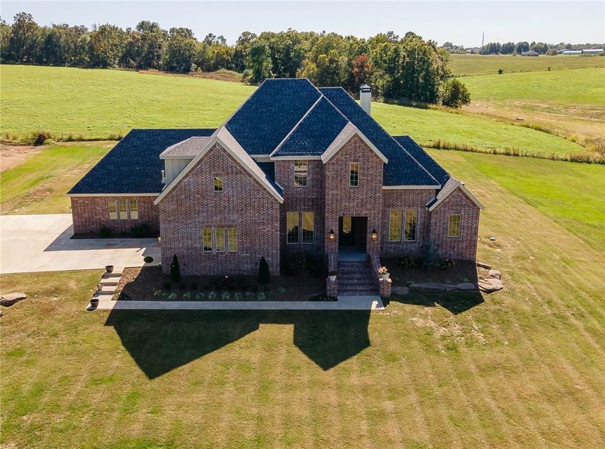 Looking for quality new construction but do not want to build??? Here is your chance to own a just like new home in a prime location situated on 1.79 acres! 3,691 heated square feet includes 4 bedrooms, 4 full bathrooms, study, formal dining, oversized living room open to eat in kitchen, large laundry, mud room, and a bonus room (which offers a closet and could be a 5th bedroom).  Amenities include hardwood floors, wood burning fireplace, cabinets to the ceiling in kitchen, brushed 3 cm granite, walk in pantry, double ovens, 5 burner gas range, mud room lockers, and large covered patio.  Extra special features include 2 bedrooms on the main floor, an amazing 4 car garage of which 1 is heated and cooled with a mini split, and an abundance of walk in attic storage.  The property offers a country feel with a 20 minute drive to Fayetteville or a 20 minute drive to Bentonville!!! Zoned for Harber HS.